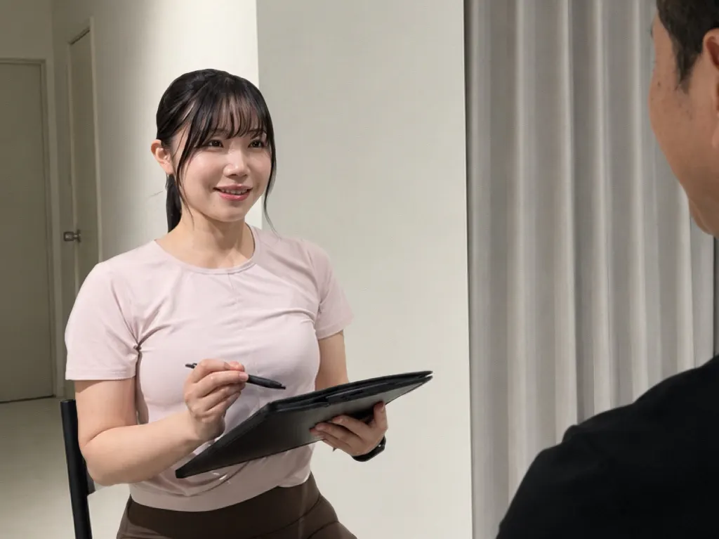 施術前に体の悩みを聞くカウンセリングの様子